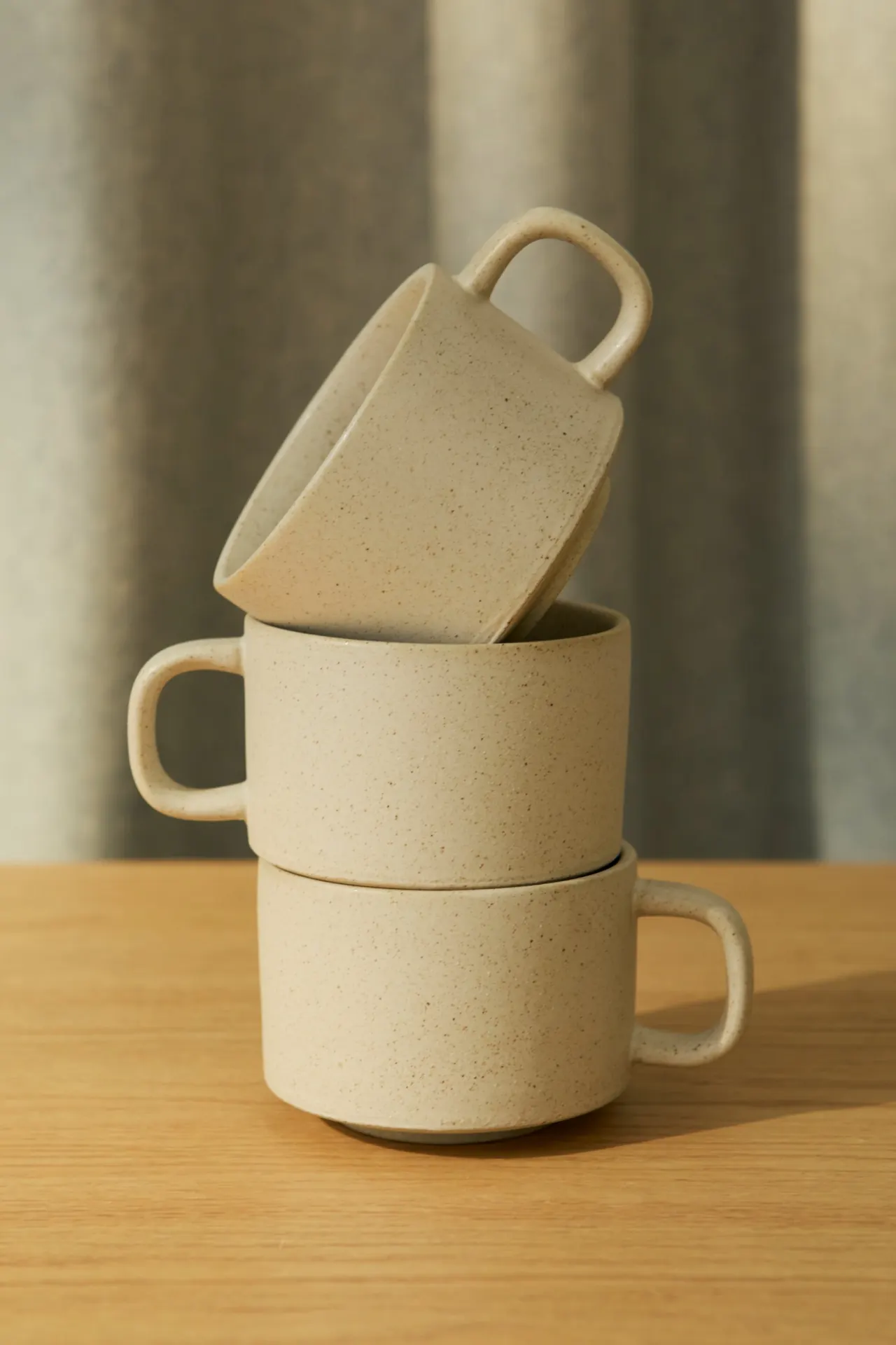 Stacked beige ceramic cups