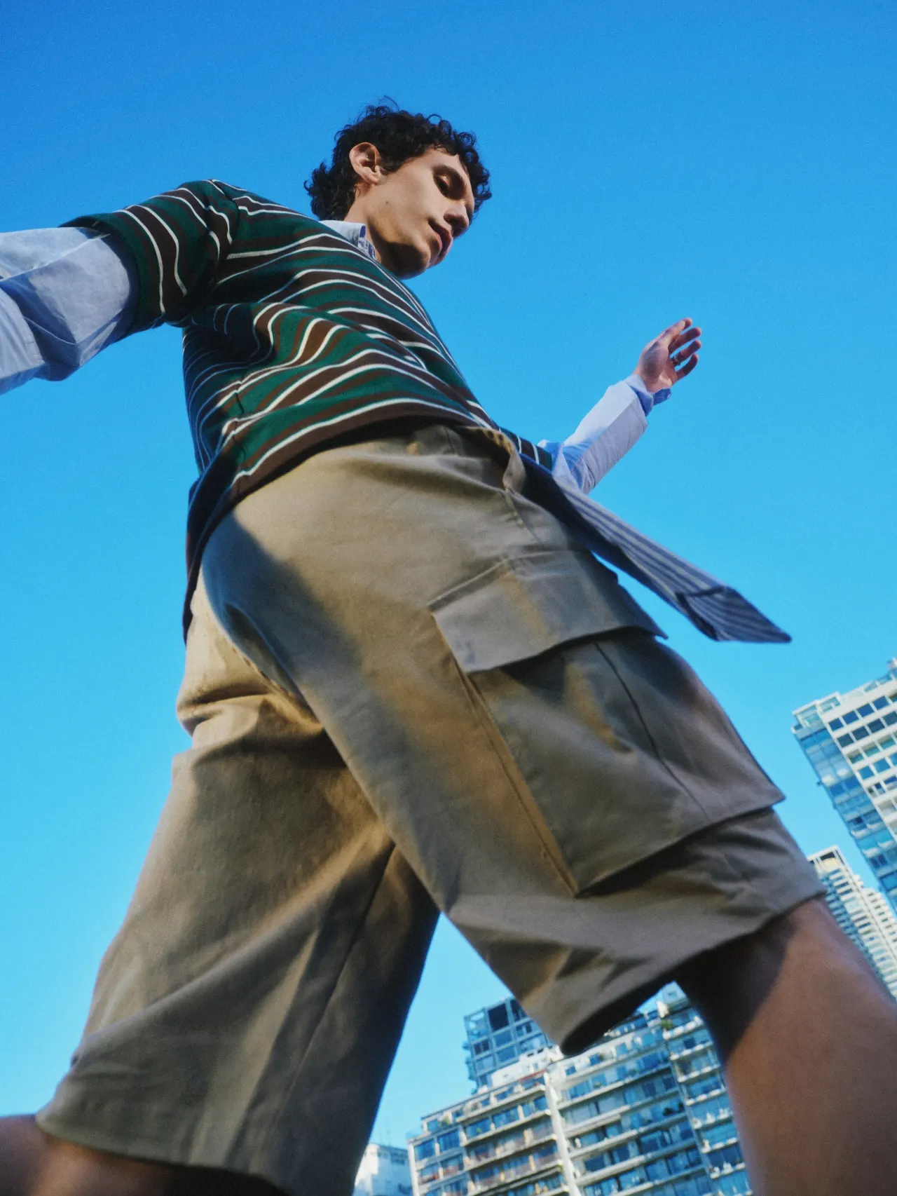 A person seen from below against the sky